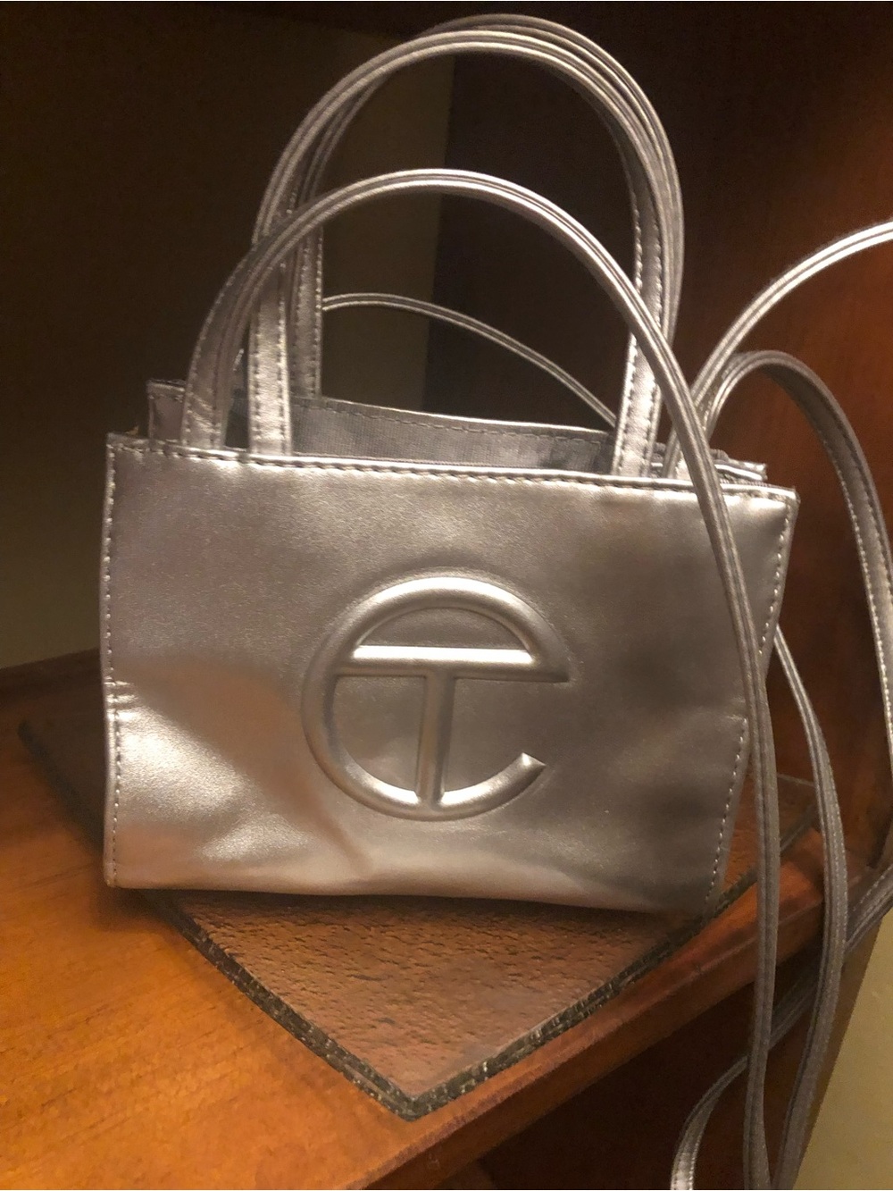 Mini Metallic Silver Telfar Crossbody Bag with Embossed Logo
